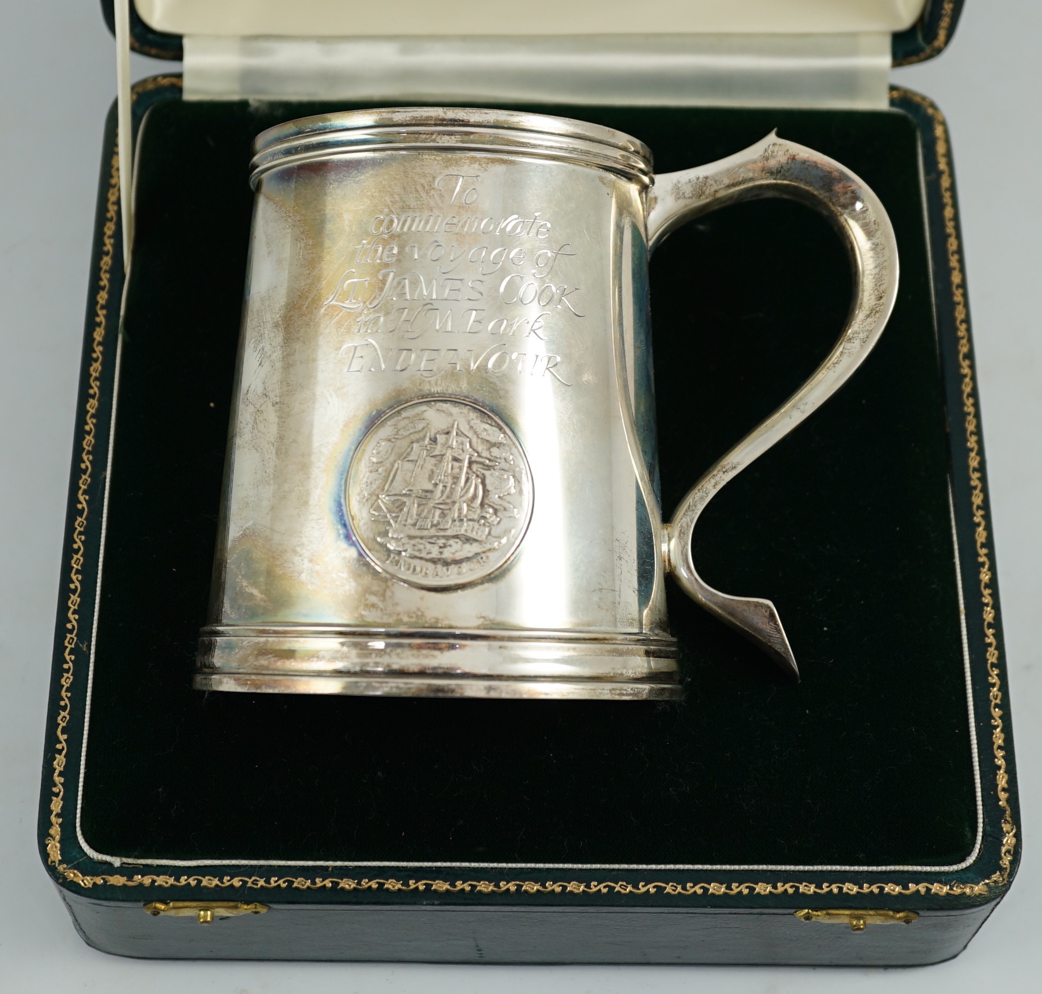 A cased Elizabeth II silver limited edition mug, engraved to commemorate the voyage of Lt. James Cook, in H.M. Bark Endeavour, to Australia